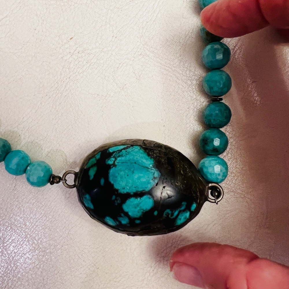 Jennifer Ponson turquoise and black pendant on turquoise beads. 18 inches total.